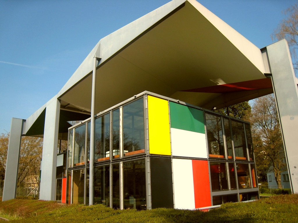 Heidi Weber Pavilion by Le Corbusier a group of statues of men standing next to each other